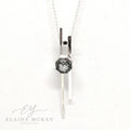 Tourmalated quartz and black cubic zirconia pendant