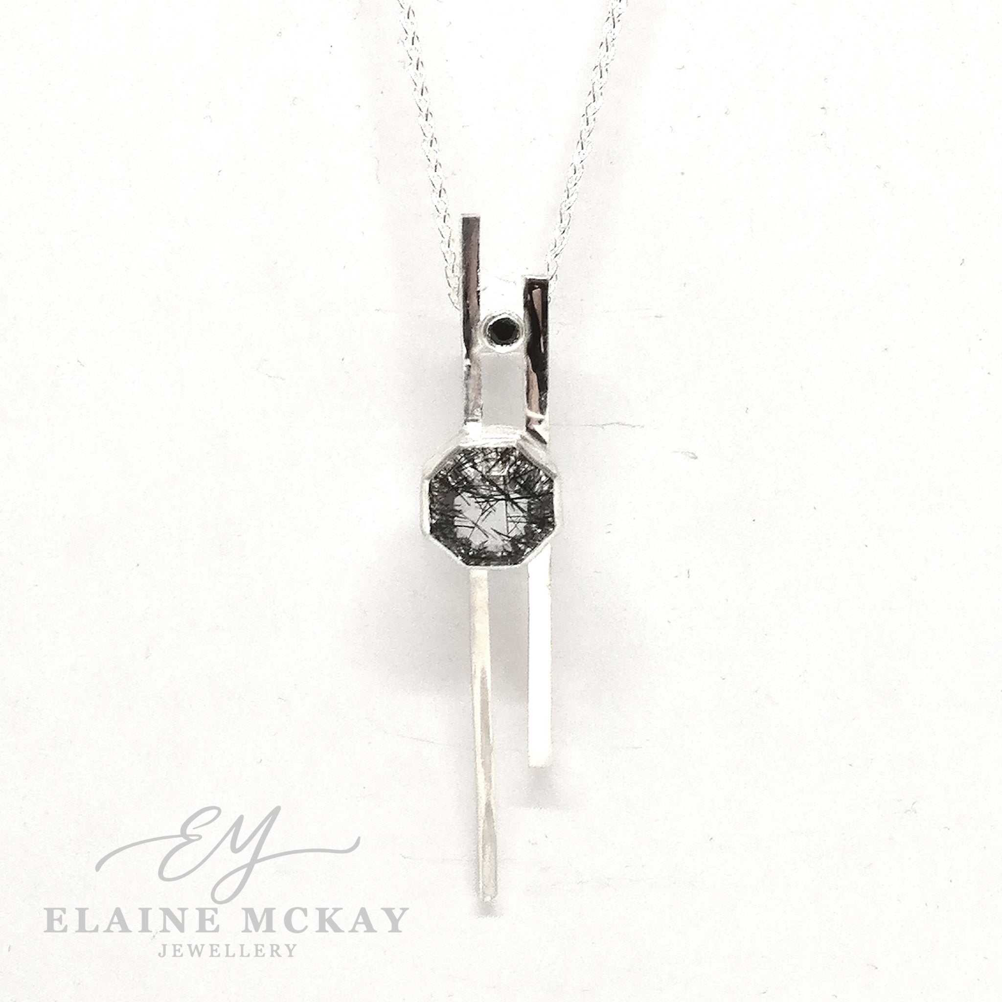 Tourmalated quartz and black cubic zirconia pendant