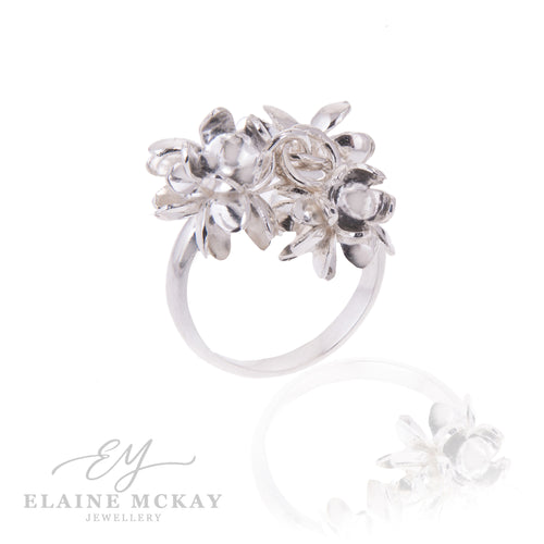 Silver floral ring on a white background with 'Elaine McKay Jewellery' branding.