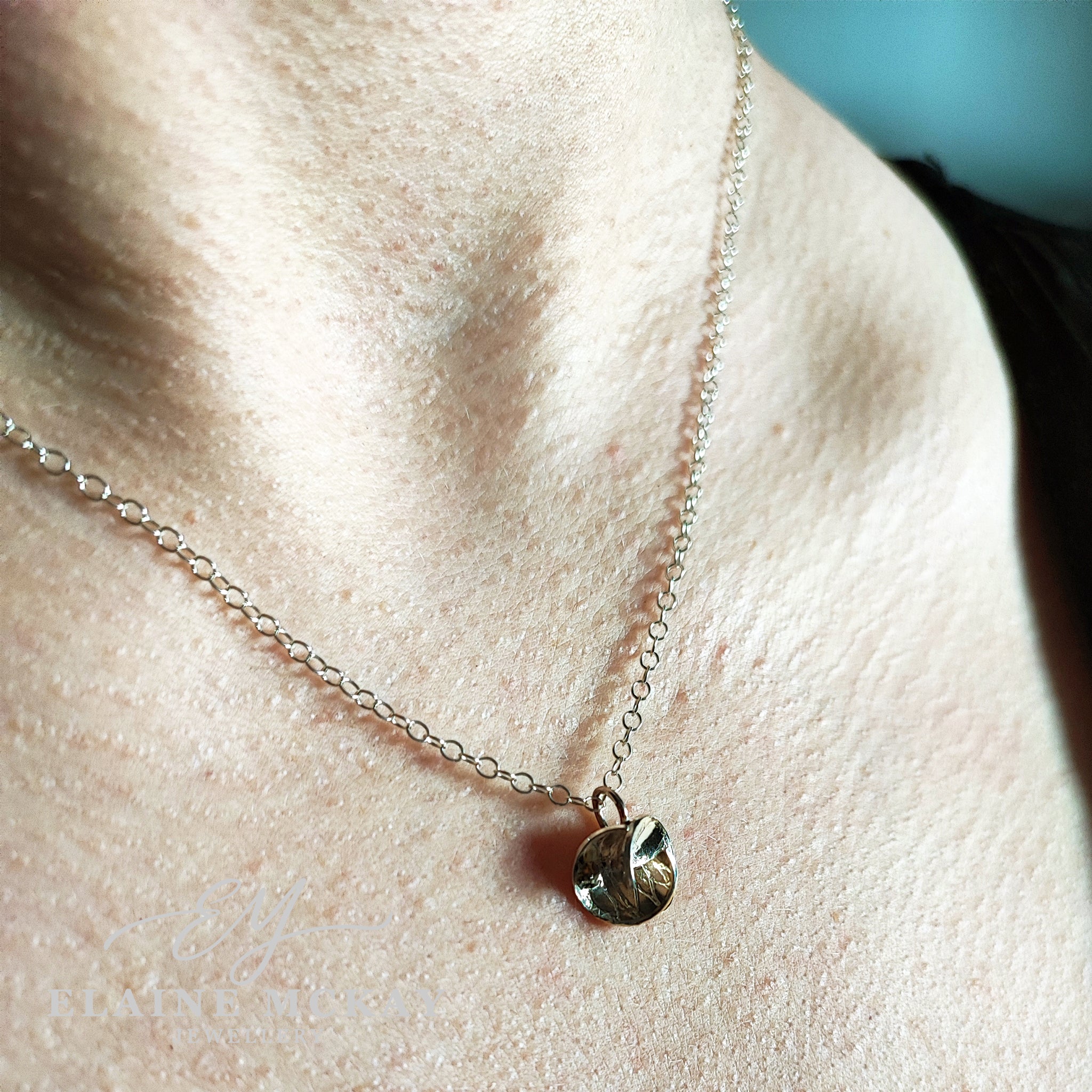 Harmony pendant on a models neck with a side view by Elaine McKay Jewellery