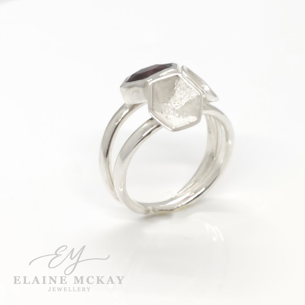 Silver ring with geometric design on a white background, branded 'Elaine McKay Jewellery'.