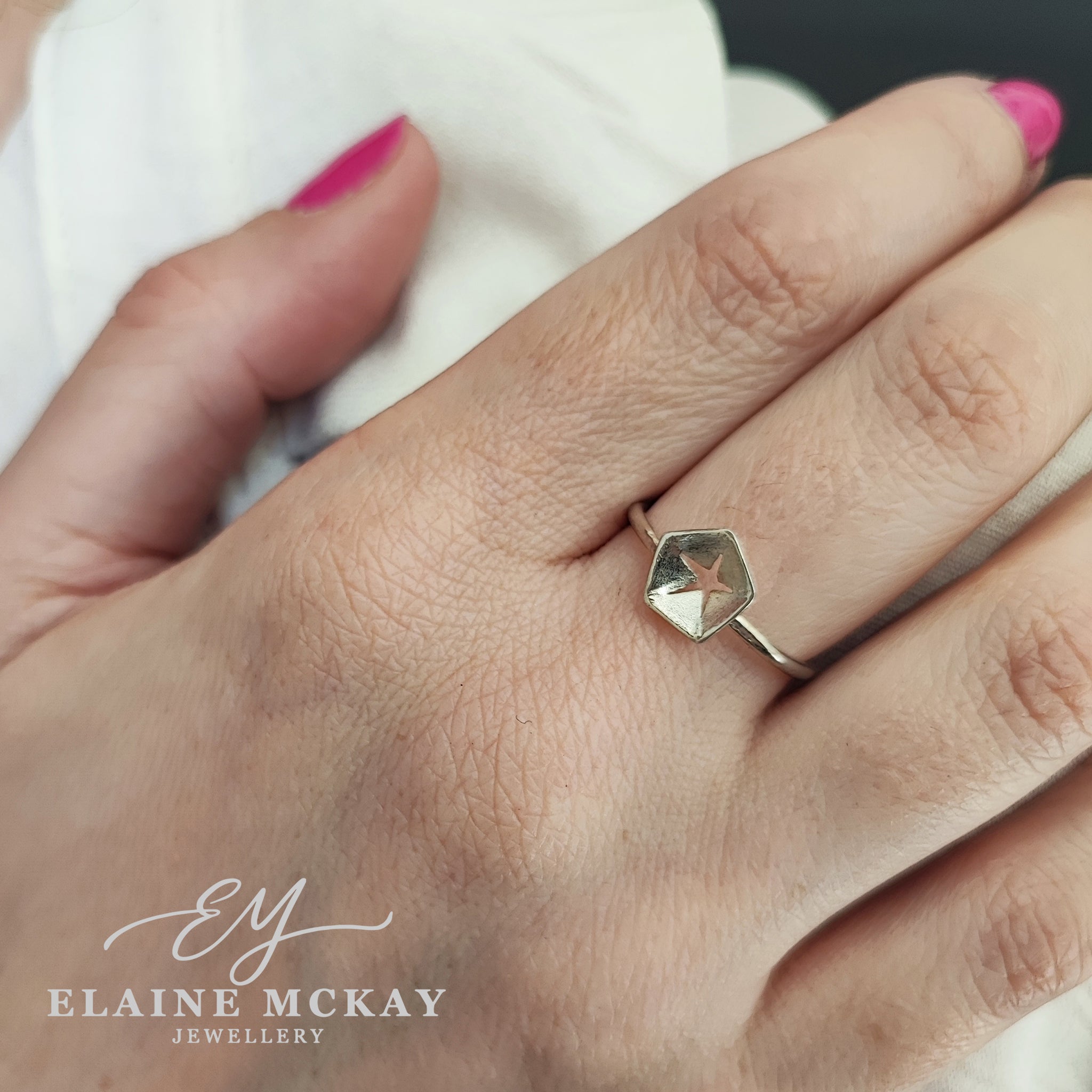 Hex silver ring in  models hand