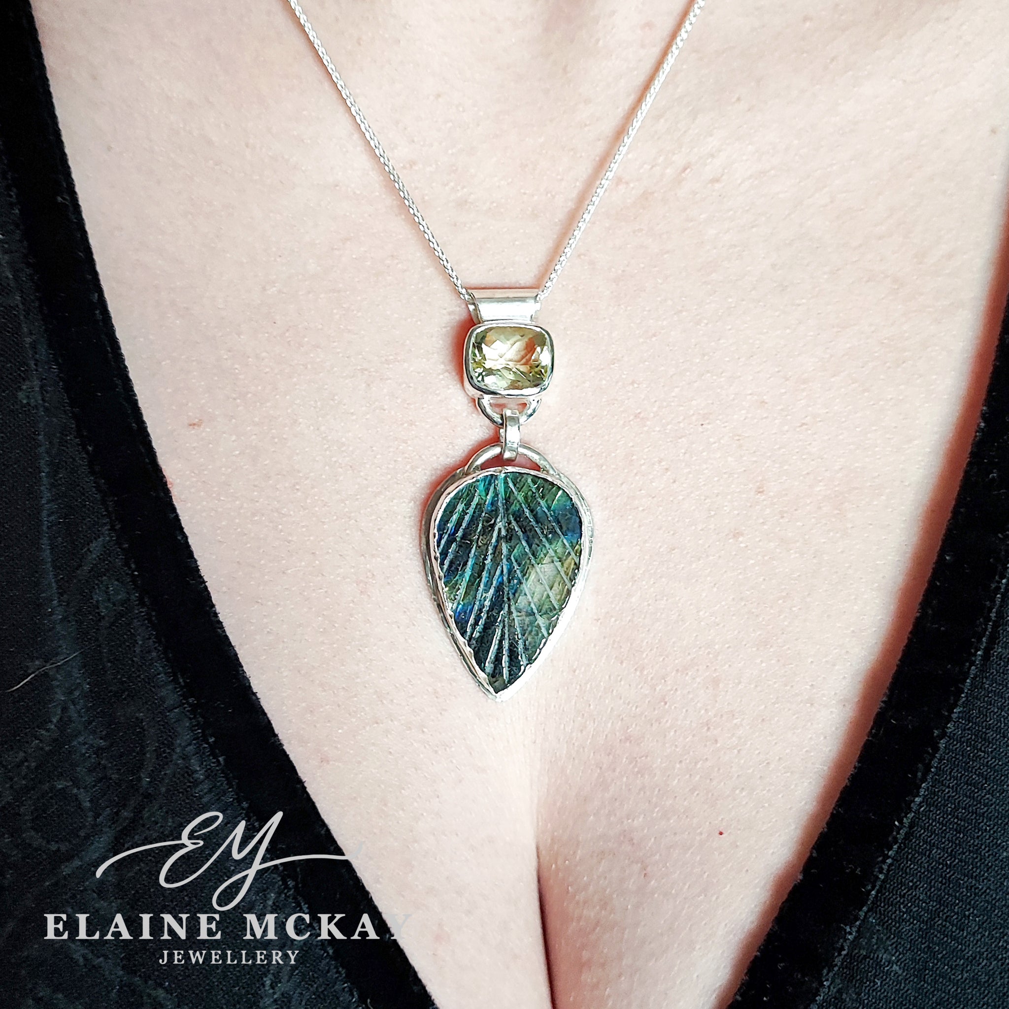 Lemon quartz and carved leaf labradorite pendant on a models neck