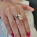 Models hand displaying pod ring on center finger