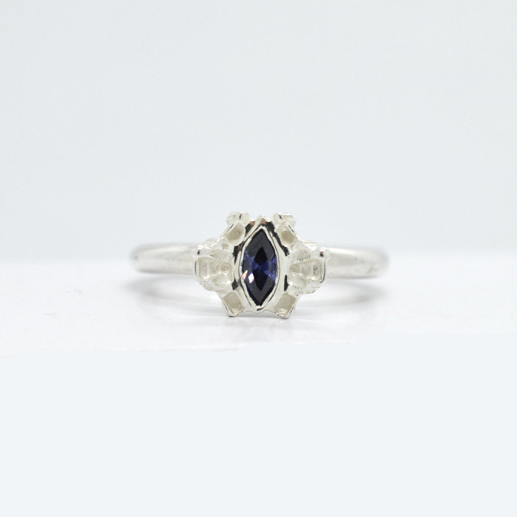 Reflect Silver ring with a tanzanite gemstone on a white background