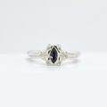 Reflect Silver ring with a tanzanite gemstone on a white background
