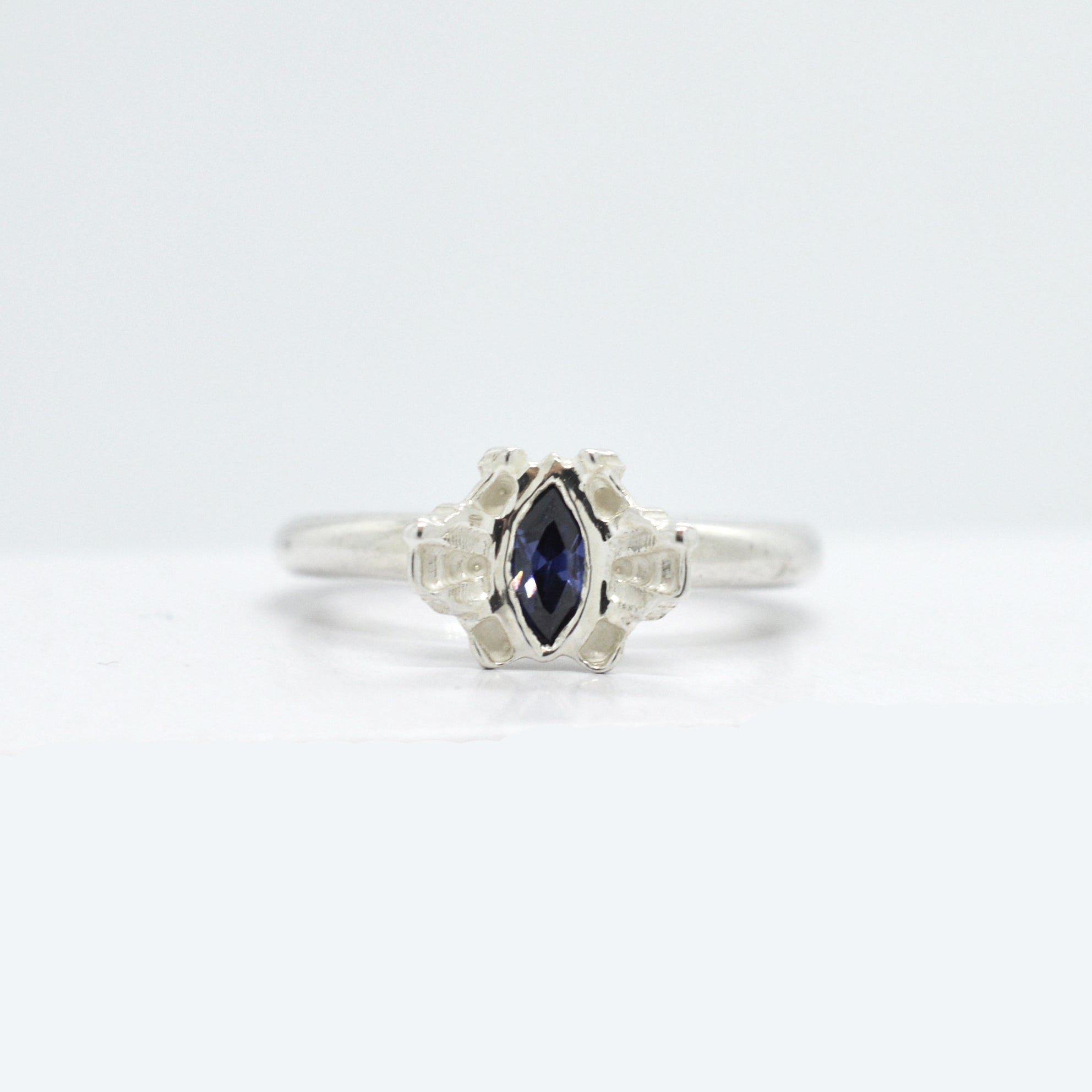 Reflect Silver ring with a tanzanite gemstone on a white background