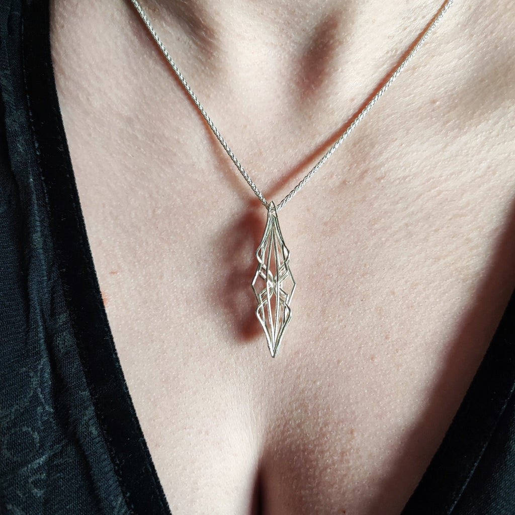 Model wearing Ricard silver necklace